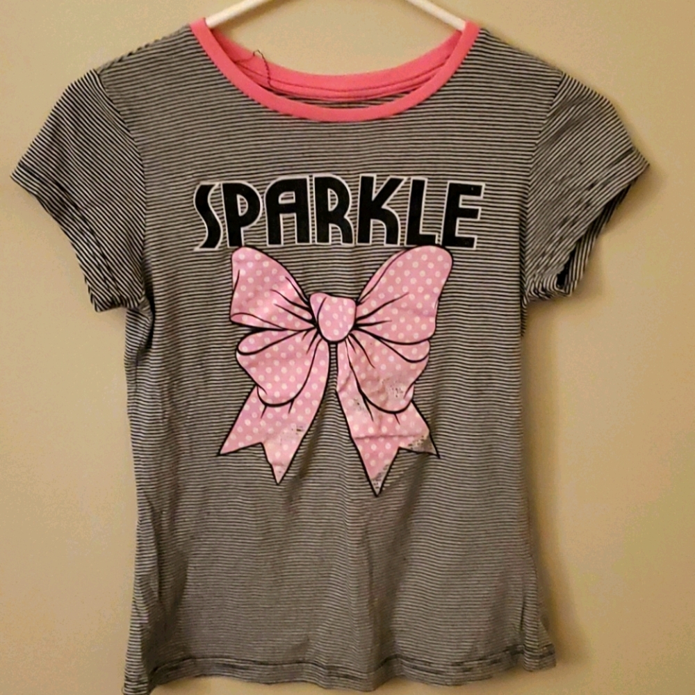 Black and white striped shirt with a bow.